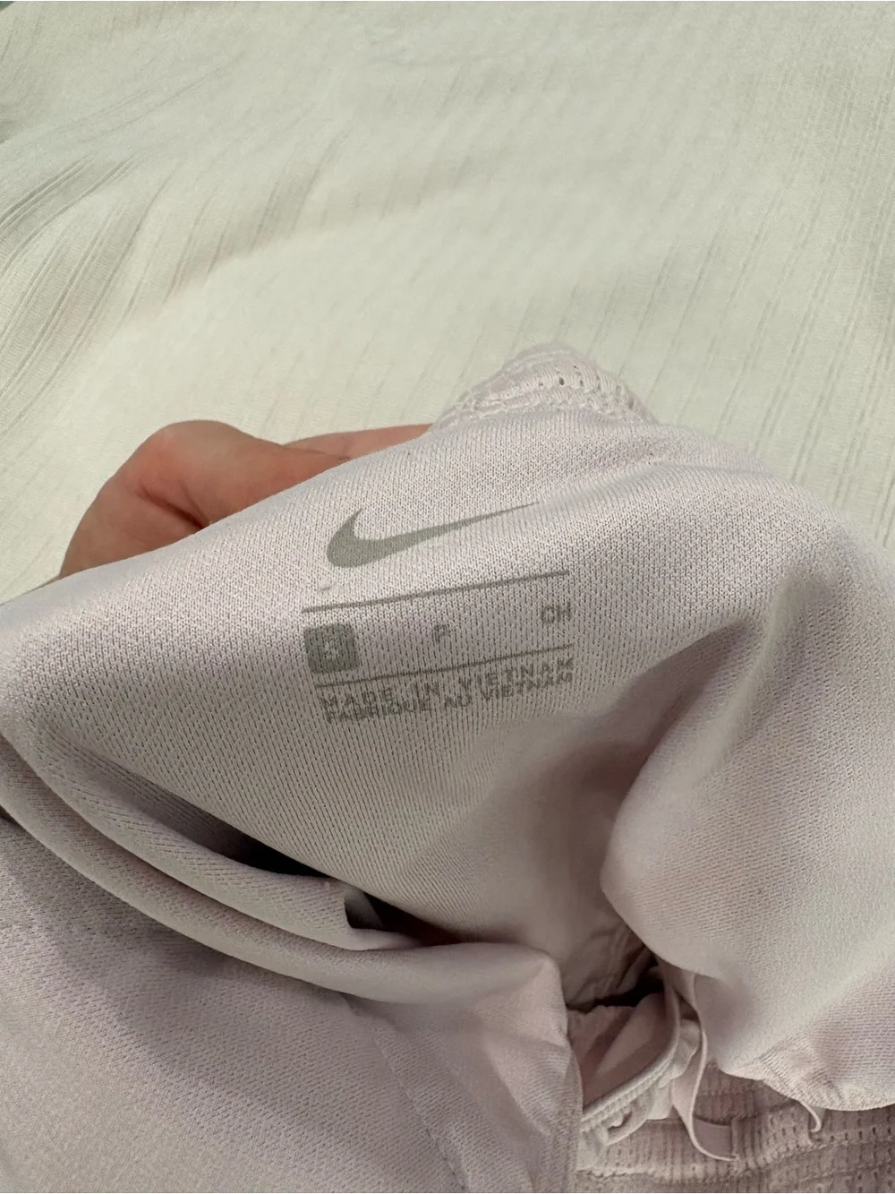 Nike Women’s Pale Pink Athletic Shorts with White Swoosh